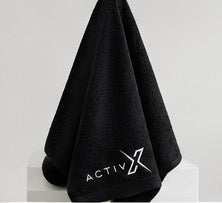 ACTIVX Bath Towel in Black — hanging view