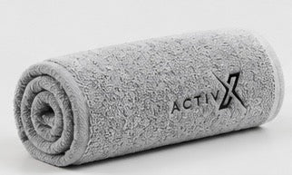 ACTIVX Bath Towel in Grey — rolled view