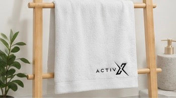 ACTIVX Bath Towel in White — rack view