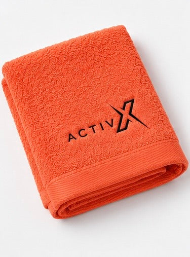 ACTIVX Hand Towel in Orange — folded view