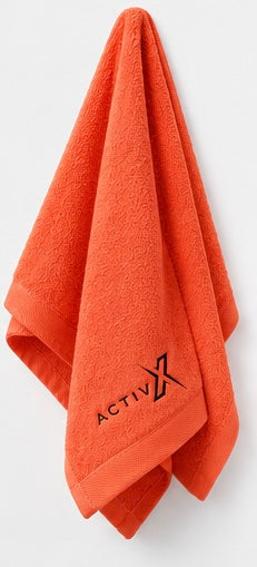 ACTIVX Hand Towel in Orange — hanging view