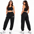 ACTIVX Women's Fleece Joggers in Black — front and back view